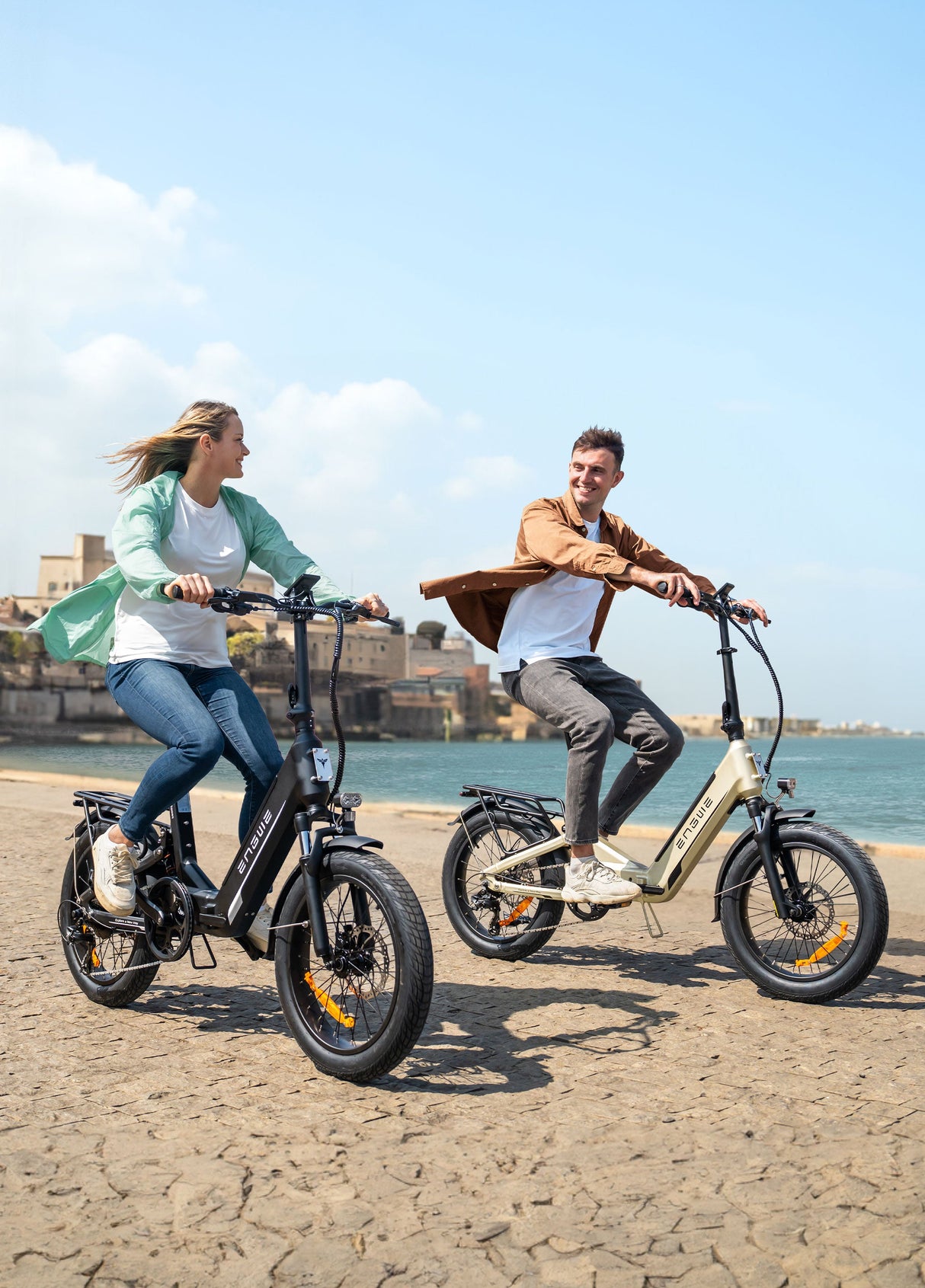 a man and a woman riding engwe l20 3.0 urban electric bicycles